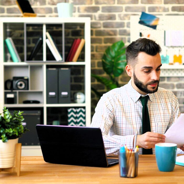Professional reviewing underwriting documents